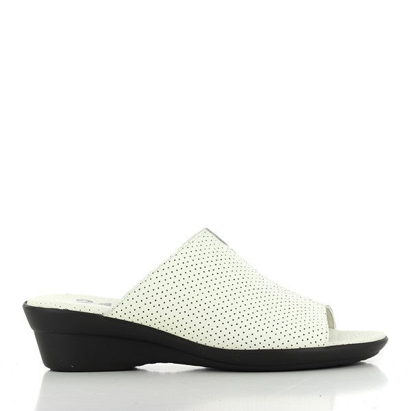 A pair of 24 Hrs 23660 White Slide-On Wedges is showcased against a clean, neutral background. The sandals feature a pristine white leather upper with a smooth finish, offering a fresh and elegant look. The 4.5 cm wedge heel is visible, providing a subtle lift. The slide-on design allows for easy wear, while the round toe shape ensures a comfortable fit. The soft leather lining is subtly highlighted, enhancing the luxurious feel, and the durable synthetic sole is shown, underscoring the quality craftsmanshi