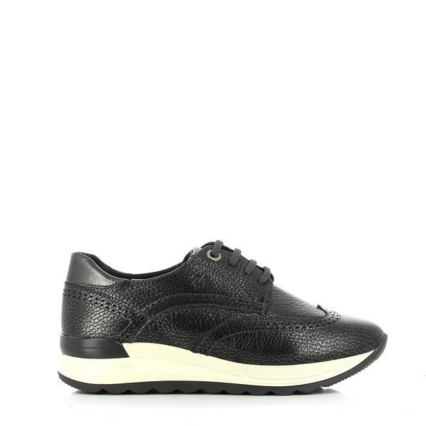 The 24HRS 23875 Black Sneakers showcase a sleek black leather upper with a clean, minimalist design. The round toe shape adds a classic touch, while the 3.5 cm heel-platform provides subtle elevation for added comfort. The interior is lined with soft leather, enhancing the luxurious feel. The durable synthetic sole ensures excellent grip and stability, making these sneakers both stylish and practical. Made in Spain, these sneakers embody expert craftsmanship and timeless style.