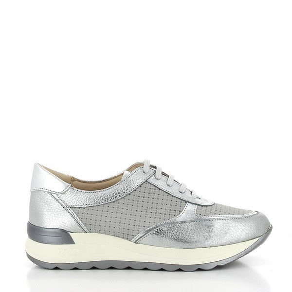 The 24HRS 23973 Silver Sneakers showcase a striking silver leather upper with a reflective, metallic finish. The design features a classic round toe and a 3.5 cm heel-platform for added comfort and elevation. The leather lining ensures a soft, breathable fit, while the synthetic sole provides durability and reliable grip. Made in Spain, these sneakers blend eye-catching style with expert craftsmanship, making them a standout addition to any wardrobe.