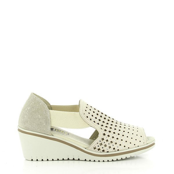 The 24HRS 23983 Taupe Wedges feature a refined taupe leather upper with a sleek, smooth finish. The classic round toe design complements the 5 cm heel-platform, providing a chic lift while maintaining stability. The interior is lined with soft leather for added comfort, and the durable synthetic sole ensures reliable traction. Made in Spain, these wedges blend sophisticated style with practical comfort, making them a versatile choice for any wardrobe.