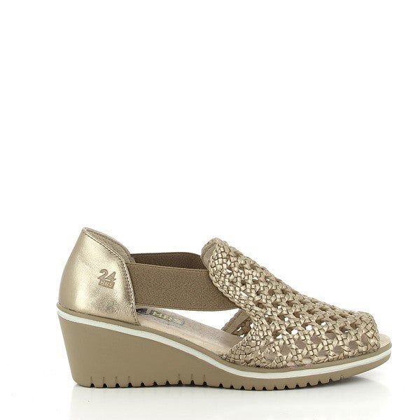 The 24HRS 23987 Taupe Wedges showcase a sophisticated taupe leather upper with a sleek, smooth finish. The round toe design complements the 5 cm heel-platform, providing an elegant lift and enhancing posture while ensuring stability. The interior is lined with soft leather for added comfort, and the synthetic sole offers durability and reliable traction. Made in Spain, these wedges combine timeless style with practical comfort, making them a versatile choice for any wardrobe.