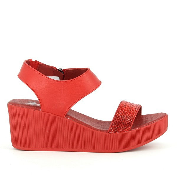 A pair of 24Hrs 24566 Res Slingback Wedges is displayed against a neutral background. The wedges feature a sleek leather upper in a rich color, with a smooth finish. The round toe design and 6.5cm heel offer a stylish elevation while ensuring comfort. The leather lining and synthetic sole are visible, emphasizing their quality and durability. The slingback design includes a subtle, adjustable strap for a secure fit. The overall presentation highlights the wedges' elegant and versatile style.