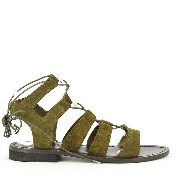 The photo presents the Antichi Romani 348 Safari Khaki Gladiator Sandals from a dynamic angle, allowing a full view of their striking design. The earthy khaki leather is soft and inviting, exuding a relaxed yet stylish vibe. Multiple leather straps crisscross elegantly across the foot, creating a sophisticated gladiator silhouette. The rounded toe shape adds a classic touch, while the meticulous stitching highlights the expert craftsmanship synonymous with Antichi Romani.