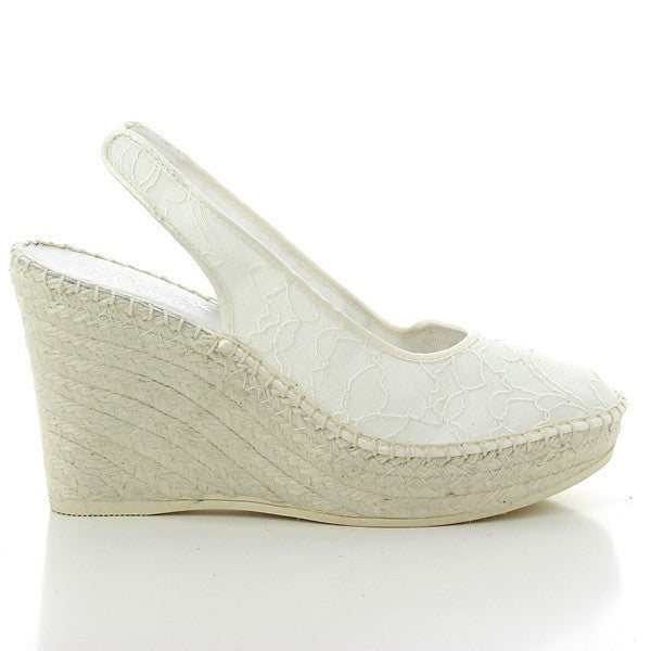 The Calzanor 130 White High Heel Espadrilles are elegantly presented, showcasing their chic design and exceptional craftsmanship. The espadrilles feature a pristine white leather upper with a classic rounded toe, radiating sophistication. The striking 10 cm high heel adds a touch of glamour while ensuring comfort and stability. Set against a neutral backdrop, the eco-friendly jute sole is highlighted, emphasizing the brand's commitment to sustainability.