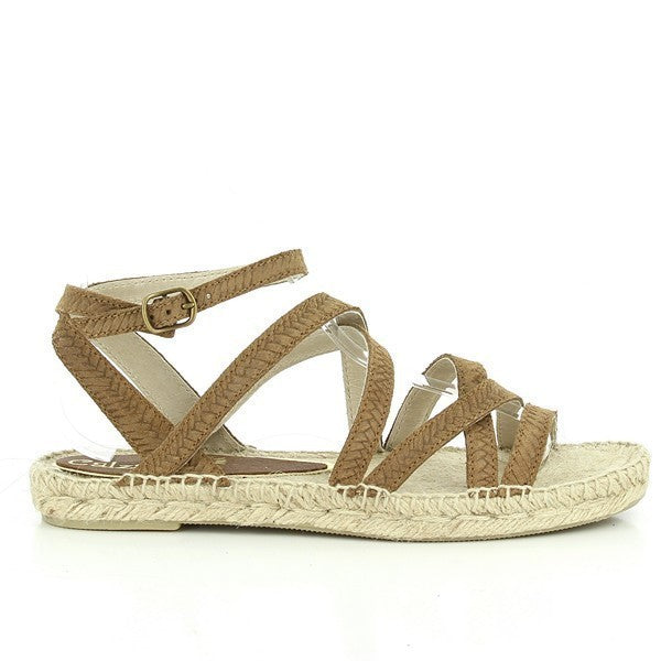 The Calzanor 1417 Brown Multi-Strap Espadrilles are showcased against a soft, neutral background that highlights their elegant design and rich color. The espadrilles feature multiple stylish brown leather straps that elegantly wrap around the foot, providing a secure yet comfortable fit. The round toe shape and low 1 cm heel are clearly visible, emphasizing the shoes' balance of comfort and style. The eco-friendly jute sole is prominently displayed, showcasing Calzanor's commitment to sustainable materials.