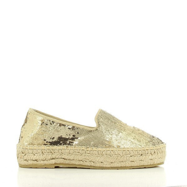 A pair of Calzanor 1852 Gold Loafer Espadrilles placed against a clean white background. The shoes feature a metallic gold leather upper with a classic loafer silhouette, round toe, and subtle stitching details. The natural jute espadrille sole adds texture, with a slight 3 cm platform for lift. The espadrilles have a sleek, minimalist design, exuding both elegance and casual sophistication.