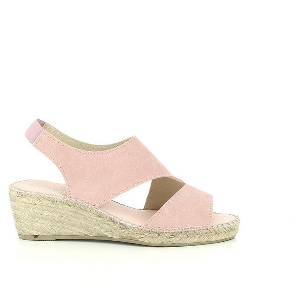 The image features the Calzanor 2042 Pink Slingback Espadrilles elegantly displayed on a soft, neutral surface. The vibrant pink leather upper shines with a smooth finish, creating a cheerful and stylish look. The slingback strap gently wraps around the heel, ensuring a secure fit, while the soft leather lining is subtly visible at the opening. The natural jute-wrapped sole contrasts beautifully with the pink, highlighting the artisanal craftsmanship. 