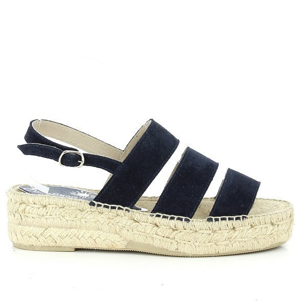 A pair of **Calzanor 2044 Navy Slingback Espadrilles** is displayed, featuring a rich navy leather upper with a soft sheen. The slingback strap adds a casual yet elegant touch, while the natural jute sole, with a 5 cm platform, complements the shoe's handcrafted, eco-friendly design. The round-toe shape offers a classic and timeless look.