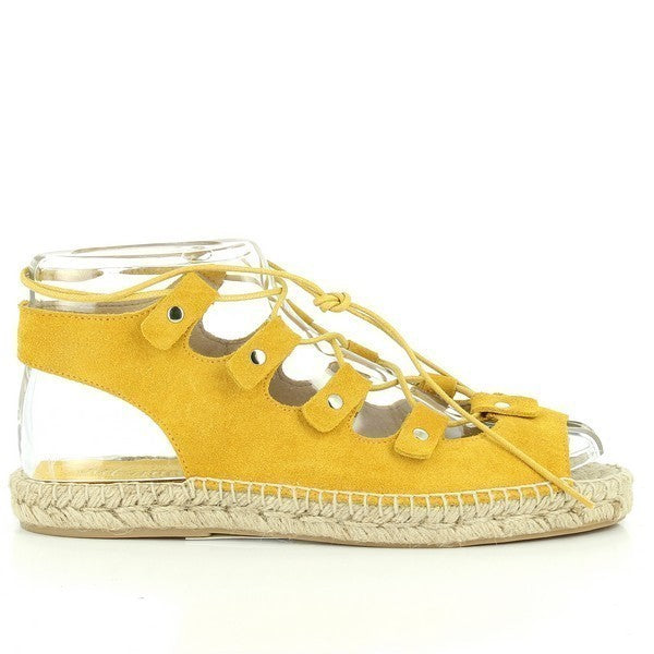 The photo features the Calzanor 93009PO Yellow Lace-Up Espadrilles, showcasing their vibrant design and craftsmanship from various angles. The side view highlights the cheerful yellow leather upper, which exudes a sunny and inviting look, making these espadrilles a perfect choice for warm weather.
