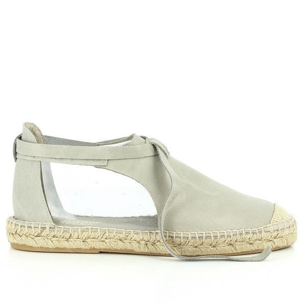 This image showcases the Calzanor 9307BPO Grey Lace-Up Espadrilles from a side angle, highlighting their elegant design and premium craftsmanship. The espadrilles feature a soft grey leather upper that seamlessly blends with the round toe shape. The lace-up design adds a touch of sophistication while ensuring a secure fit. The natural jute sole is visible, emphasizing its eco-friendly construction. 