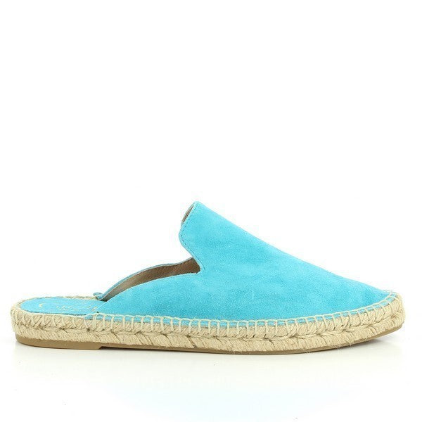 The image showcases the Calzanor 9409PO Aqua Blue Slide Espadrilles, featuring a vibrant aqua blue hue that captures attention. The espadrilles are designed with a soft leather upper and lining, offering a luxurious look and comfortable fit. The round toe shape adds a classic touch, while the lightweight synthetic sole provides durability and support. The natural jute fiber sole is visible, highlighting the eco-friendly materials used in its construction. 