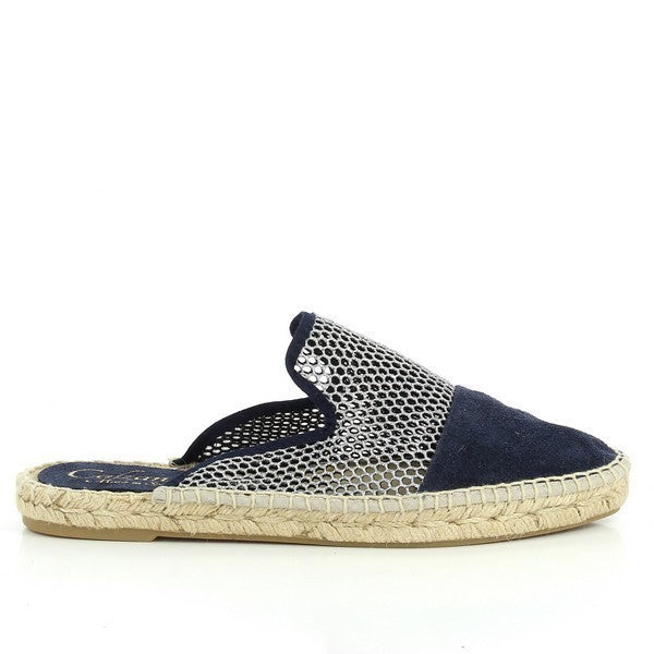 A close-up of the Calzanor 9410PO Navy Slide Espadrilles, featuring a sleek navy leather upper, soft leather lining, and an eco-friendly synthetic sole. The espadrilles are beautifully handcrafted in Spain, showcasing their timeless design and superior craftsmanship. The classic round toe shape and 1cm heel-platform height add to their stylish and comfortable appeal. Perfect for casual, warm-weather wear, these espadrilles offer both elegance and sustainability.