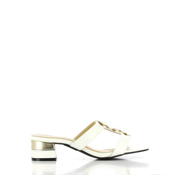 The photo showcases the Dalessi Daisy White Slides, highlighting their sleek leather upper in white and a round toe for a comfortable fit. The soft leather lining enhances comfort, while the 5 cm heel adds a subtle lift for a touch of elegance. The synthetic sole provides durability and traction, ensuring stability with every step. These slides exude a clean, sophisticated look, making them the perfect addition to any wardrobe.