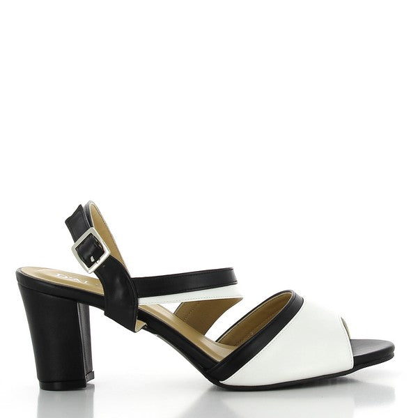 The side view of the Dalessi Daylong Black & White Slingback Heels showcases the clean, elegant silhouette with a leather upper. The 7 cm heel adds sophistication while maintaining comfort.