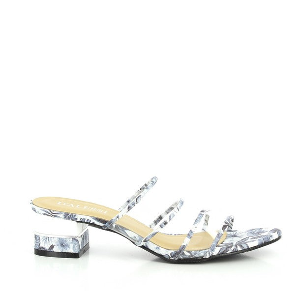 A side view of the Dalessi Decor Grey Slides shows the four thin, grey straps with delicate tropical motifs and the unique 4 cm transparent heel that adds a subtle lift.