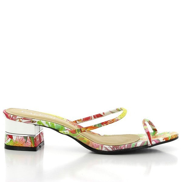 The Dalessi Dejavu White Slides are captured from the side, highlighting their sleek white leather upper and two thin straps adorned with tropical motifs. The soft leather lining is visible from the open sides, providing a luxurious touch. The 5 cm platform heel adds a subtle lift, while the round toe design ensures comfort and a relaxed fit. The synthetic sole is visible at the bottom, designed for durability and grip. 