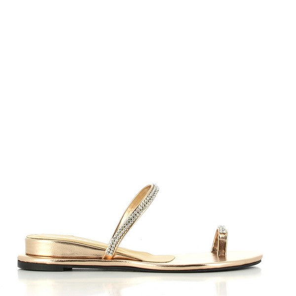 The side view of the Dalessi Diamond Gold Slides highlights the smooth gold leather upper and the 3cm heel-platform. The thong strap design ensures a secure fit, while the thin upper strap with strash detailing adds a touch of glamour.