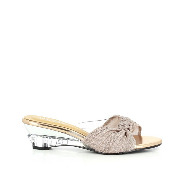 A clean profile of the Dalessi Dresden Rose Gold Slide, showcasing its sleek synthetic upper and stylish round toe design. The front knot detail adds a chic, elegant touch to the slide.
