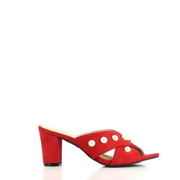 A close-up of the Dalessi Pearl Red Slide from the side, showcasing the smooth red leather upper with decorative pearls along the strap. The round toe shape is clearly visible, offering a sophisticated, classic look.