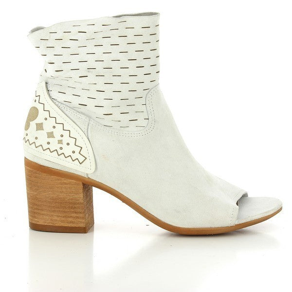 The side of the ankle boot showcases its sleek, minimalist design, featuring a smooth leather upper with a subtle curve along the foot and an elegant open toe.