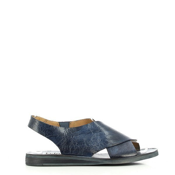 The Felmini B112 Ink Blue Cross-Strap Sandals, featuring a sleek, smooth leather upper with crisscross straps, offer a refined side profile with a comfortable 2 cm heel.