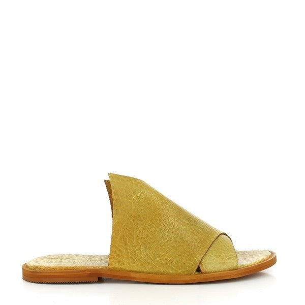 A side profile of the Felmini B836 Mustard Slides, showcasing the sleek and smooth leather upper with cross straps that create a stylish, contemporary design. The round toe and low heel platform complete the clean, modern look.
