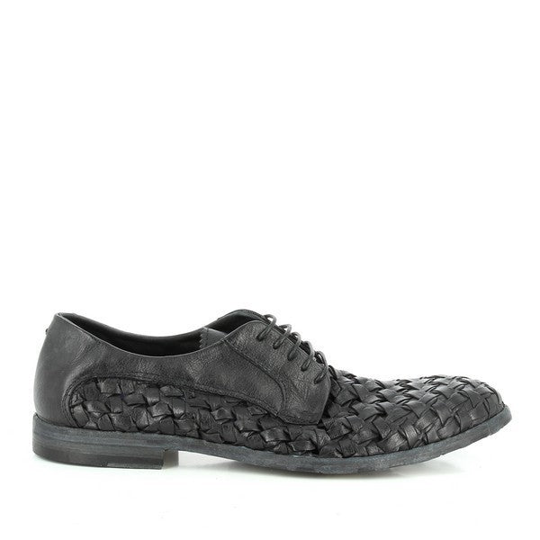 A close-up of the shoe's side highlights the intricate braided leather upper, showcasing its texture and the seamless craftsmanship. The round toe and slightly elevated 2cm heel are visible, enhancing the shoe's classic profile.