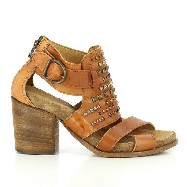 A profile shot of the sandal showcasing the clean lines and design, featuring the cross-straps on the front, decorative golden studs, and a sleek 7cm leather-wrapped heel.
