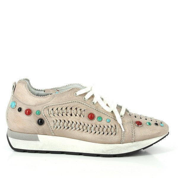 A clean side profile of the Forte 8260 Nude Sneakers, showcasing the neutral nude leather upper adorned with vibrant red, black, turquoise blue, and green stud accents. Braided leather detailing runs elegantly along the side for added texture and sophistication.