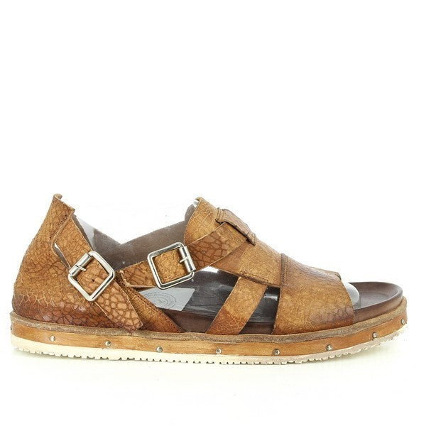 A clear side view of the Forte S16-4126 Tan Sandals, showcasing the smooth leather upper and the distinct golden buckle fastening across the straps.