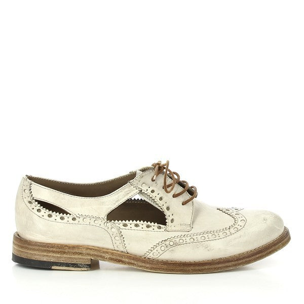 The Forte S19-8412 Ivory White Brogue showcases its classic silhouette, intricate perforated detailing, and smooth leather texture along the upper. The round toe and low-profile 2.5cm heel-platform are visible, highlighting its timeless design.