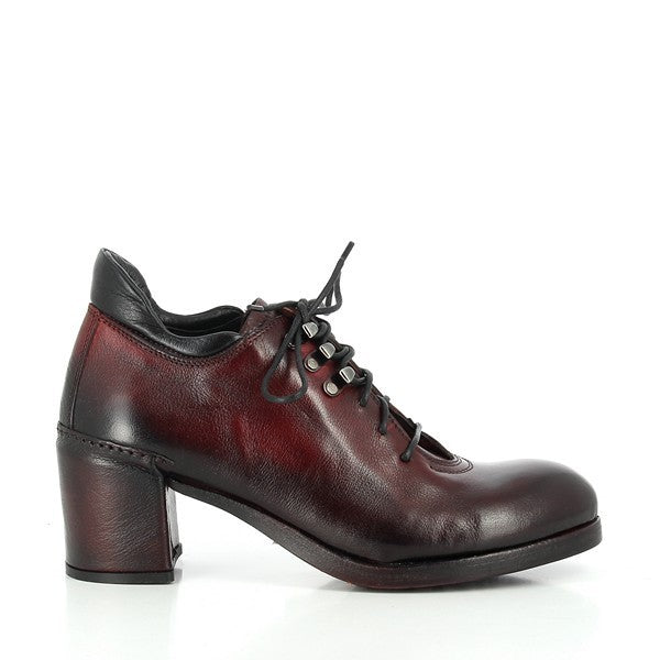 A clear profile shot of the Forte W198800 Burgundy Lace-Up Ankle Boots, showcasing the sleek leather upper with a rich burgundy hue, round toe, and lace-up design for a secure and stylish fit.