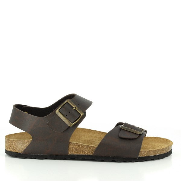 In this captivating image, Plakton's 101521 Dark Brown Slingback Sandals take center stage. Crafted with sustainable cork construction and tailored for men, these sandals exude style and comfort. The dark brown hue adds sophistication to any ensemble, while the adjustable straps ensure a personalized fit. Experience the perfect blend of sustainability and craftsmanship with Plakton's Sandals.