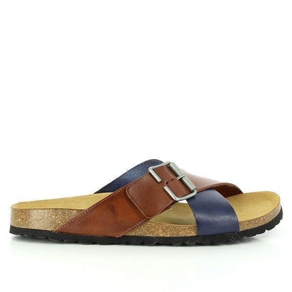 In the image, Plakton's 105011 Tan & Navy Cross-Strap Sandals are showcased, featuring a stylish cross-strap design in tan and navy leather. The golden buckle adds a touch of elegance. Crafted with care in Spain, these sandals offer both fashion and comfort, with a 2.5cm platform heel for added lift. Step into sophistication with Plakton's Sandals.