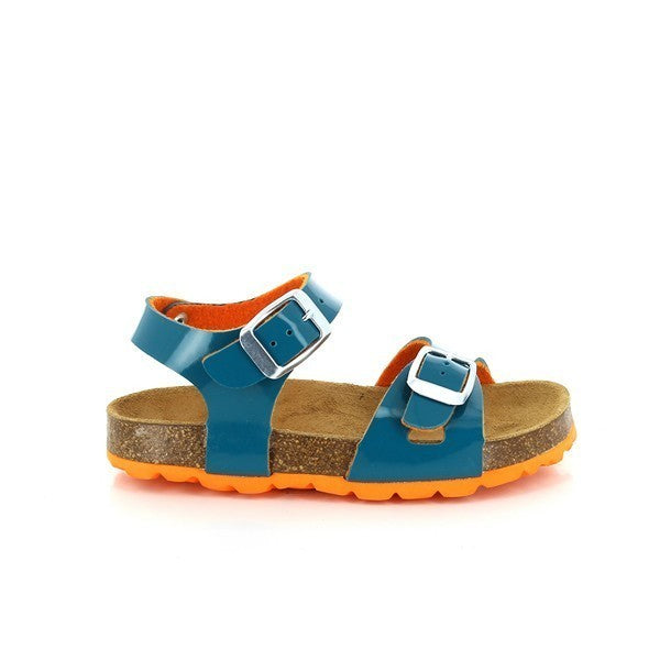 A close-up of Plakton's 111407 Turquoise Kids Sandals showcasing the vibrant turquoise leather upper. The sandals feature adjustable straps and an ankle strap for a secure fit, complemented by a round toe shape that offers ample room for comfort. The cork sole, paired with a bright orange synthetic sole, adds a pop of color and provides optimal support and cushioning. The anti-bacterial insole with an orange synthetic lining ensures breathability and lasting freshness.