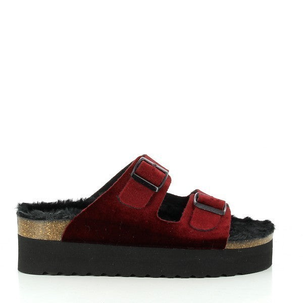 A profile shot showcasing the sleek design of the burgundy fur platform sandals, highlighting the adjustable buckles and synthetic cork sole.